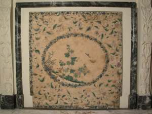 Chimney-board in the Yellow Taffeta Bedroom at Osterley Park, decorated with a Chinese picture of birds, insects, flowers and rocks surrounded by decorative floral patterns, second half 18th century, possibly originally used as wall decoration. ©National Trust Collections