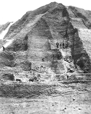 Workers in the 1860s excavate a "mountain" of guano more than 60 feet tall. Photograph © Smithsonian Institution