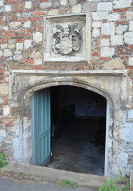 The Lucas coat of arms over the entrance © Copyright Ashley Dace 2012and licensed for reuse under this Creative Commons Licence.